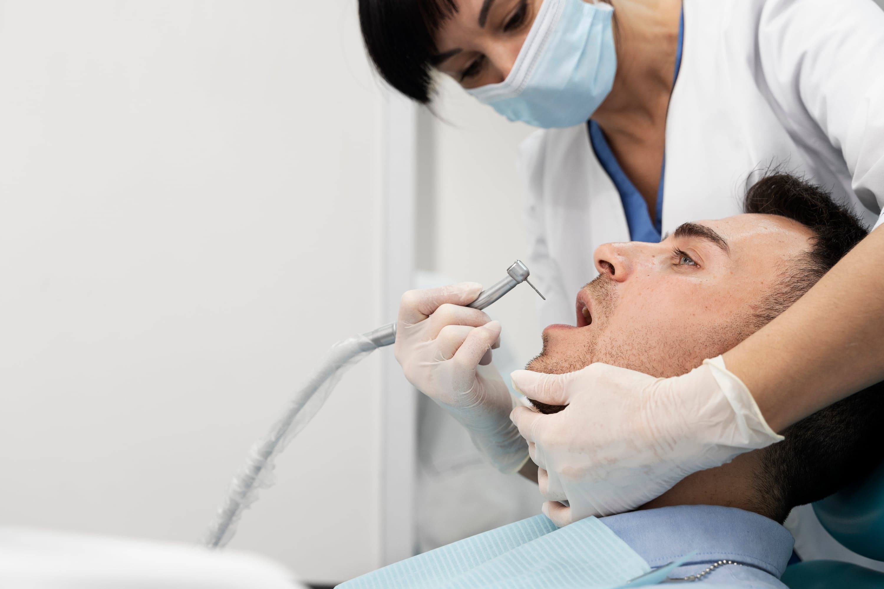 Patient smiling after reviewing their tooth-coloured filling plan