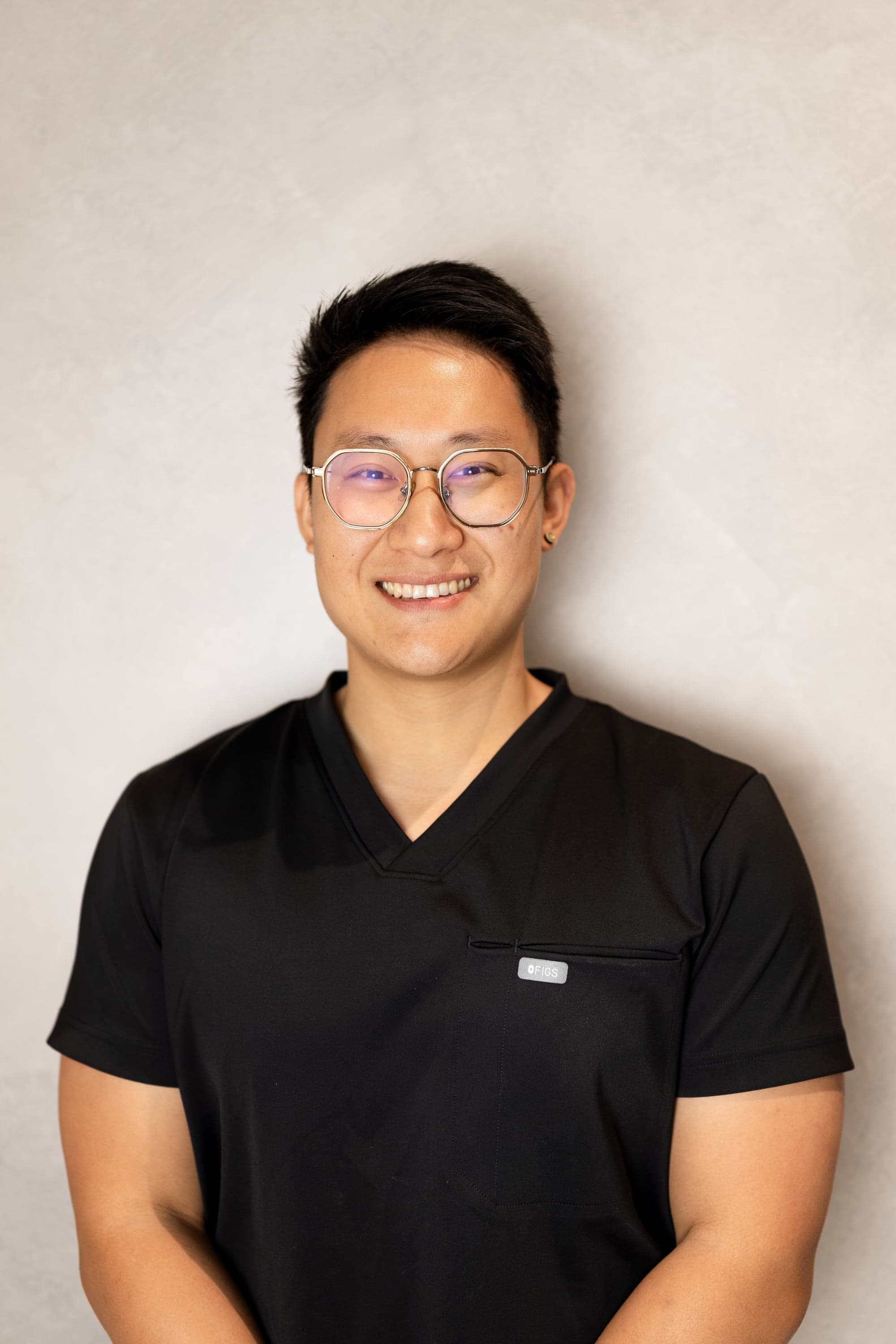 Dr Vince Wen, Principal Dentist at Joyner Family Dental, in a professional headshot with a warm smile