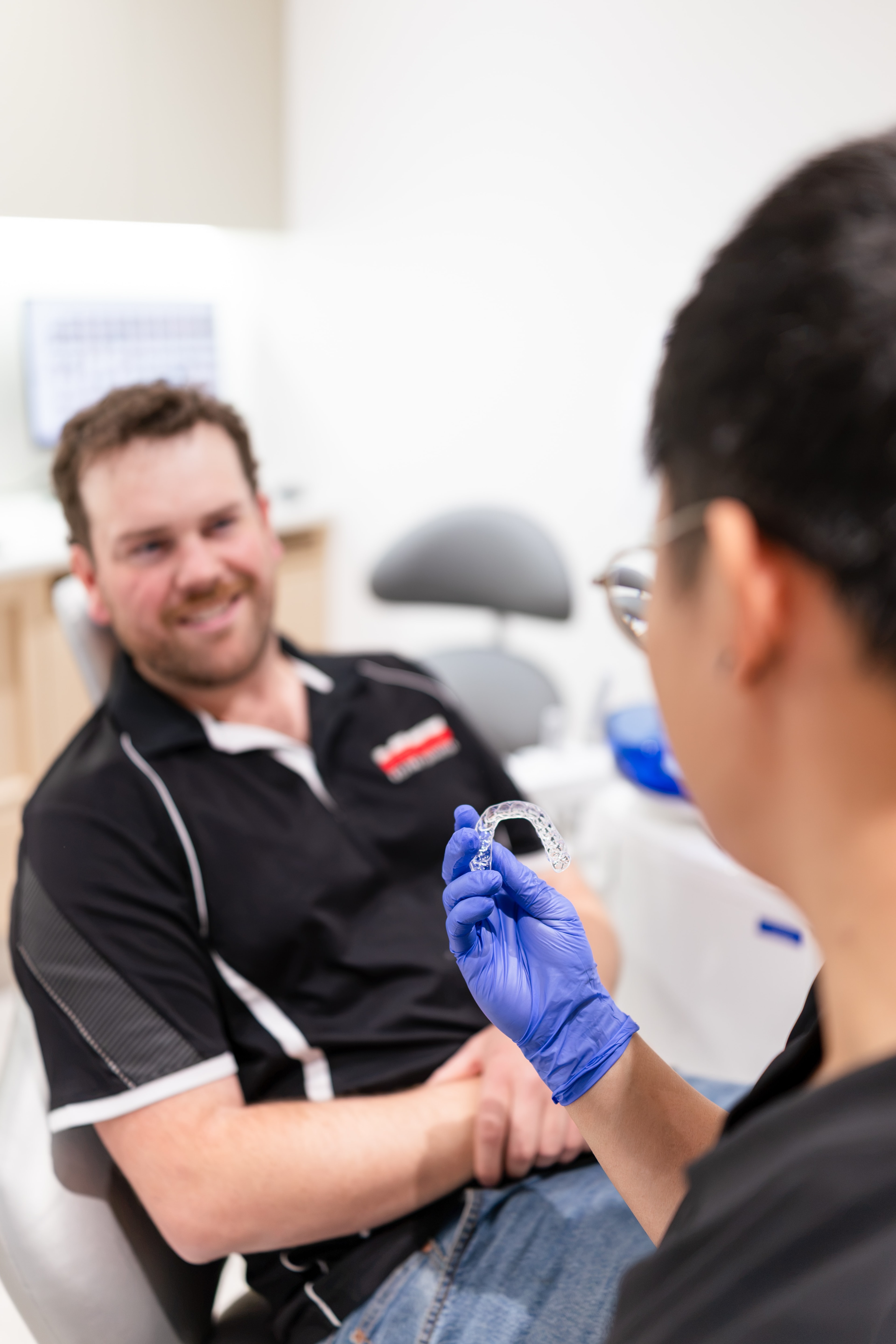 Dentist reviewing clear aligner treatment options with a patient