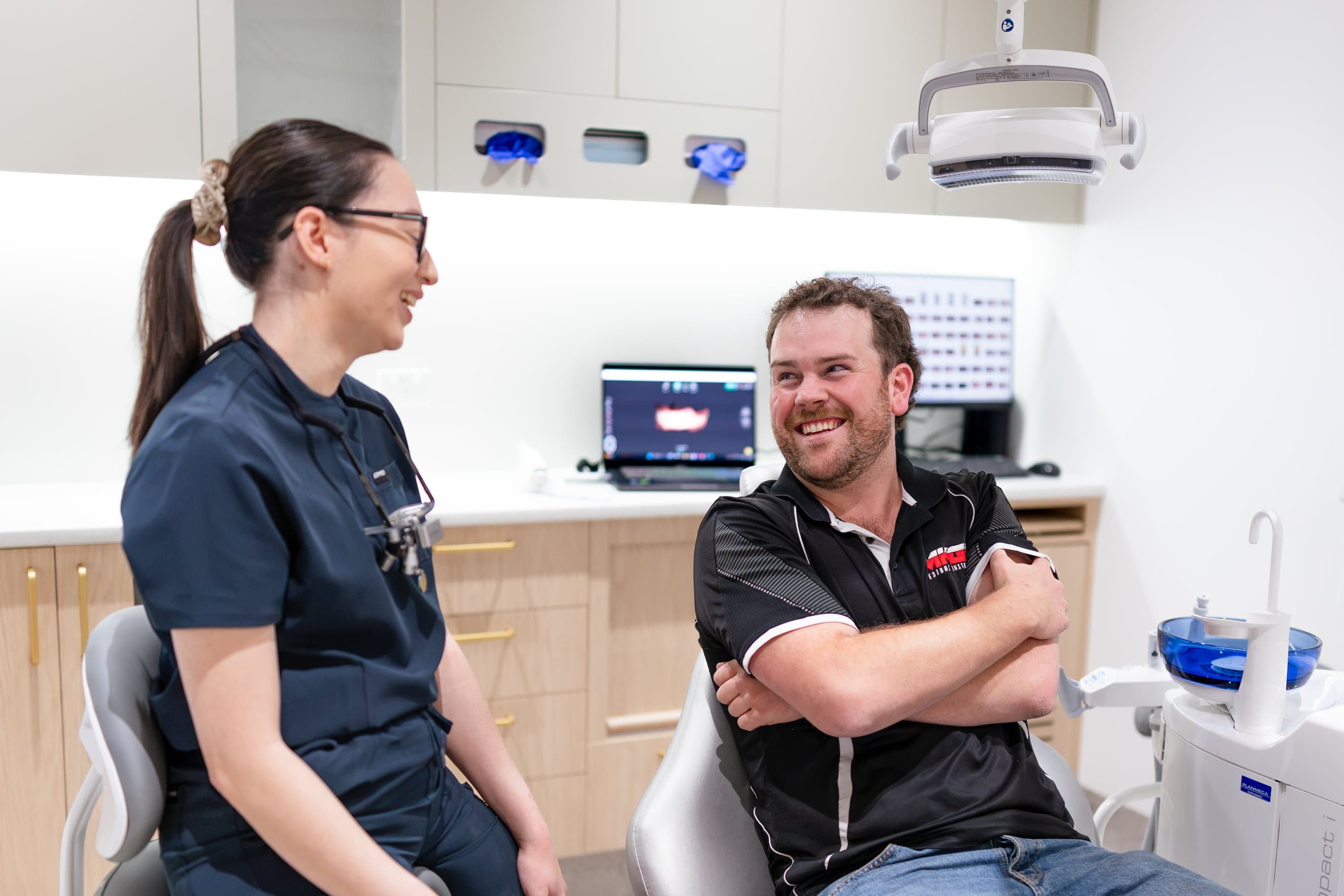 Dentist explaining crown options for structural protection after root canal treatment